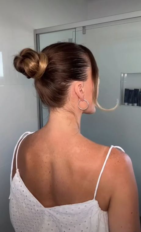 Polished high bun hairstyle for an elegant old money look