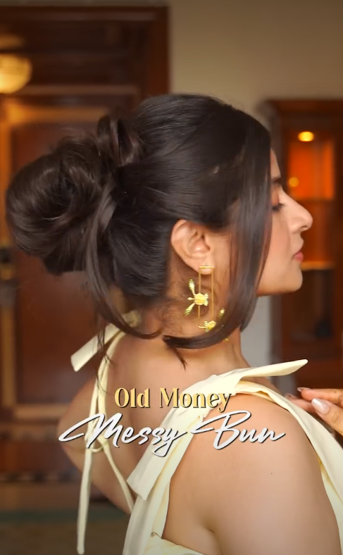 Effortless messy old money bun hairstyle with soft face-framing strands