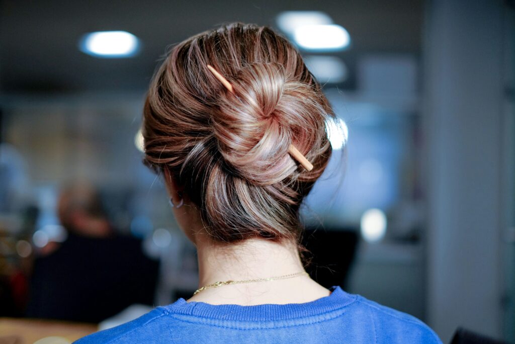 Loose elegant bun hairstyle with a soft low bun for a graceful old money look