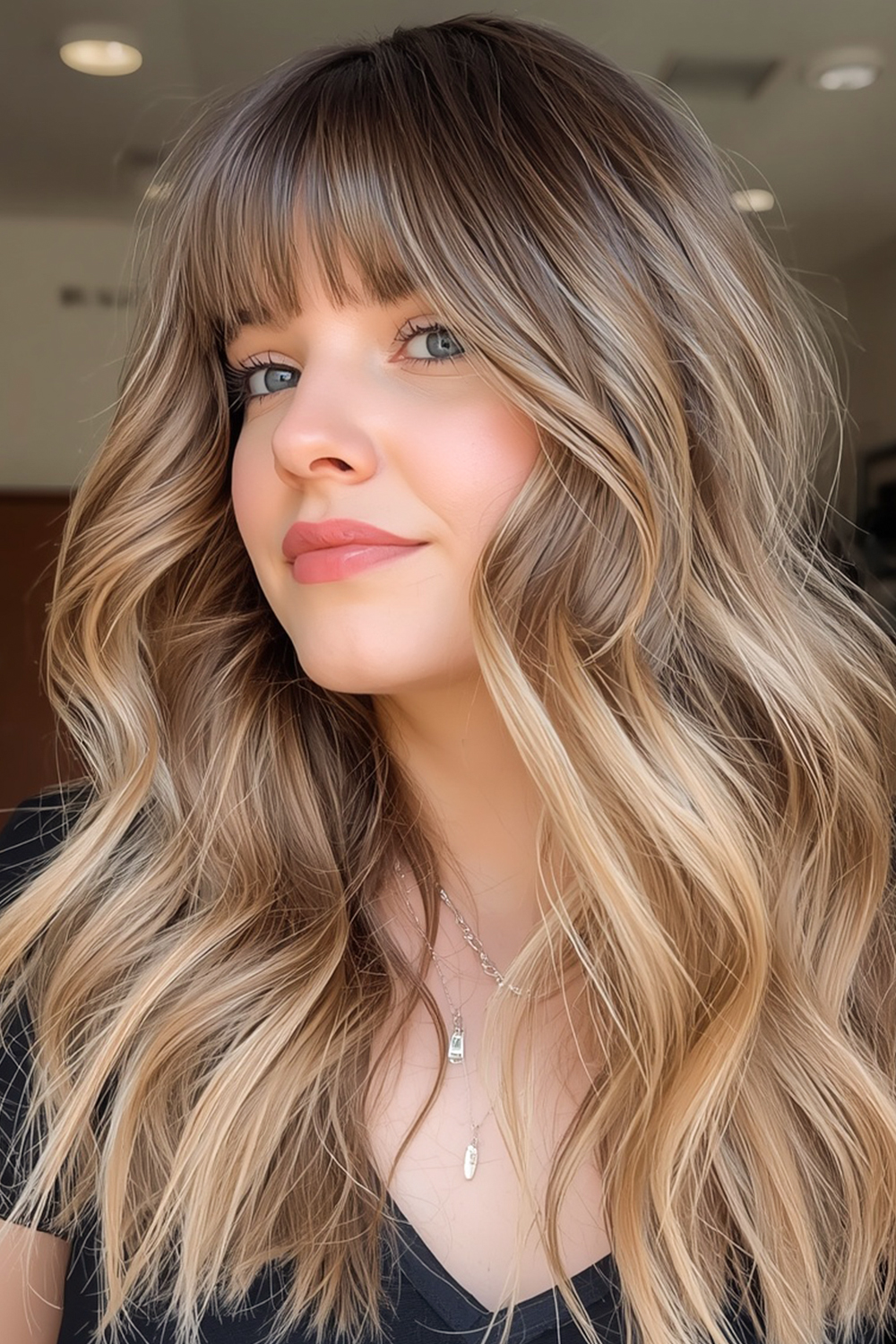 Wavy layers with curtain bangs create a soft, romantic hairstyle. The waves add texture, while the curtain bangs frame the face beautifully.