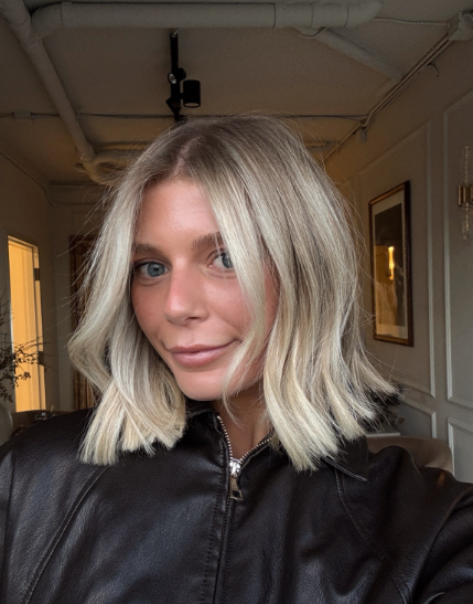A creamy blonde textured bob is a chic and modern hairstyle that gives short hair a soft, polished look.