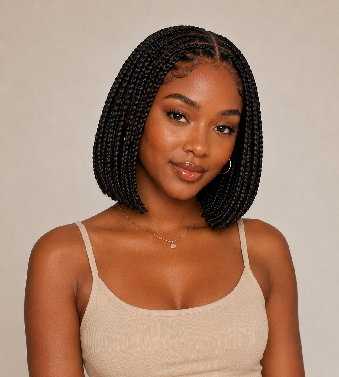 The knotless bob keeps braids short and rounded at the jawline, offering a chic, low-maintenance alternative to longer styles.