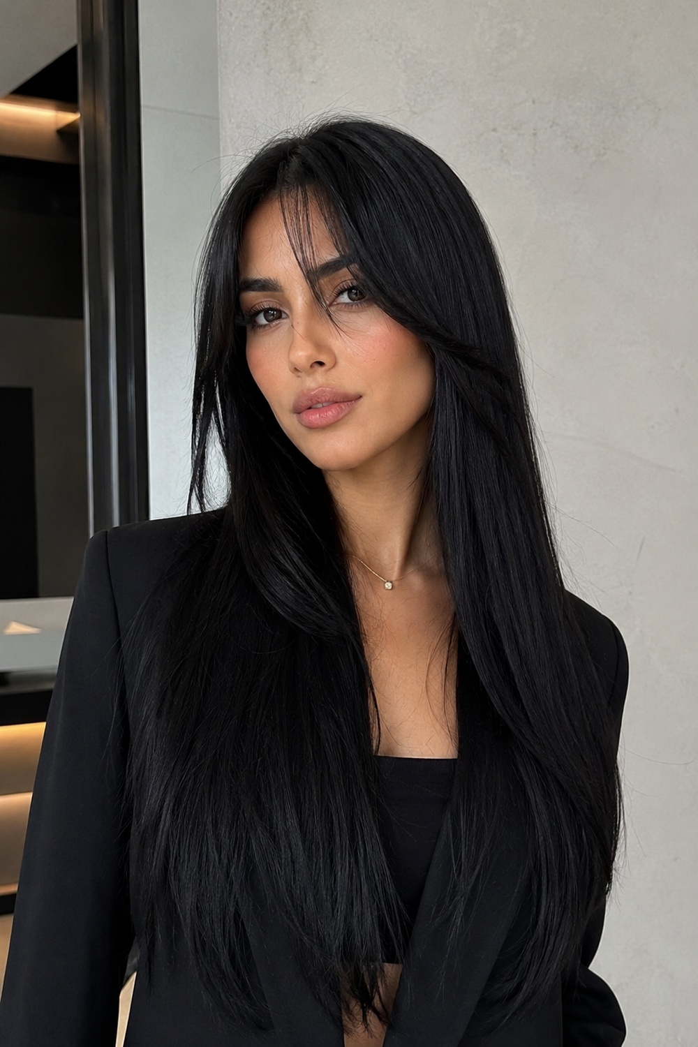 Jet-black straight long hair with curtain bangs.