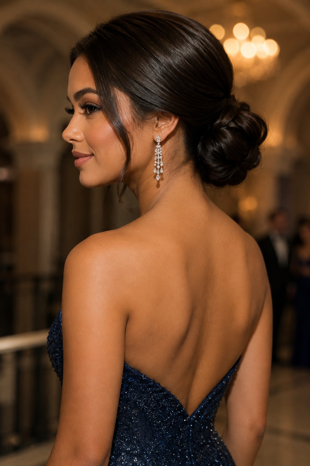 The classic chignon gathers hair into a smooth, low bun at the nape, offering timeless elegance for formal occasions.