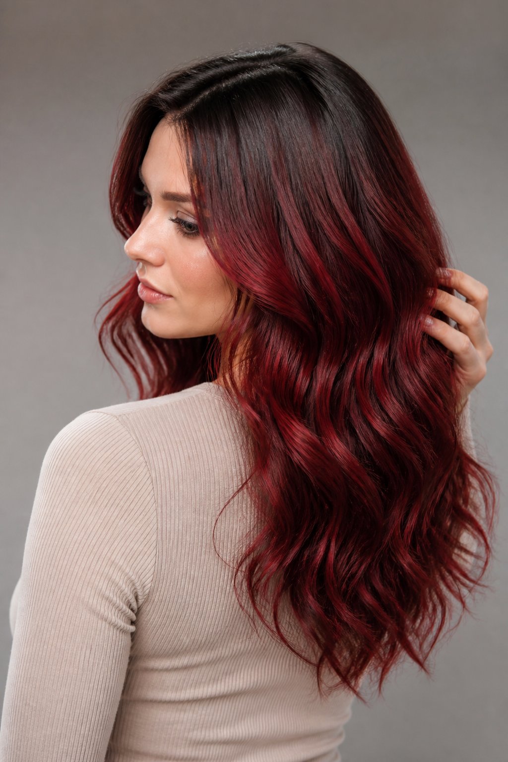 This technique softens the line between your natural roots and the cherry red color, creating a shadowed, blended effect at the base.